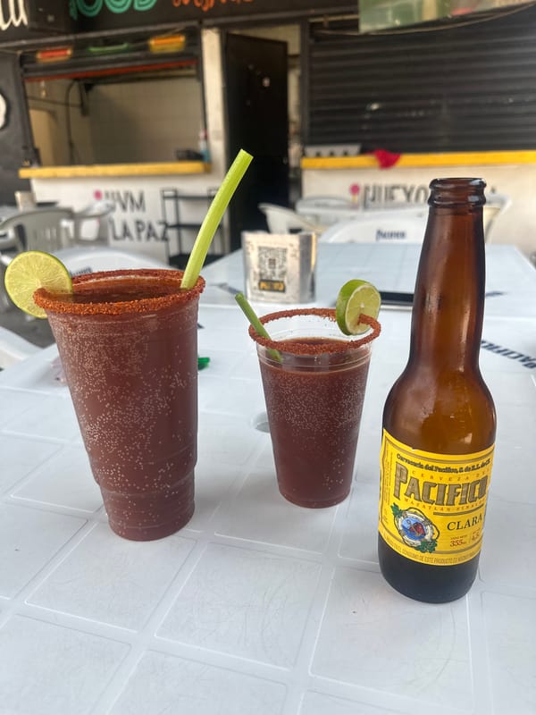 Micheladas and beer photographed at outdoor table in Mexico