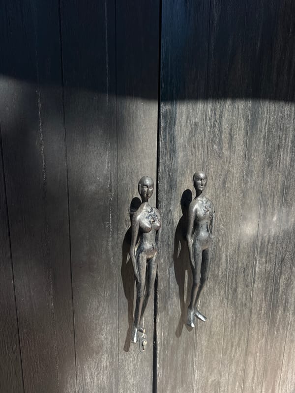 Metal figurines spotted on wooden surface in Pecatu