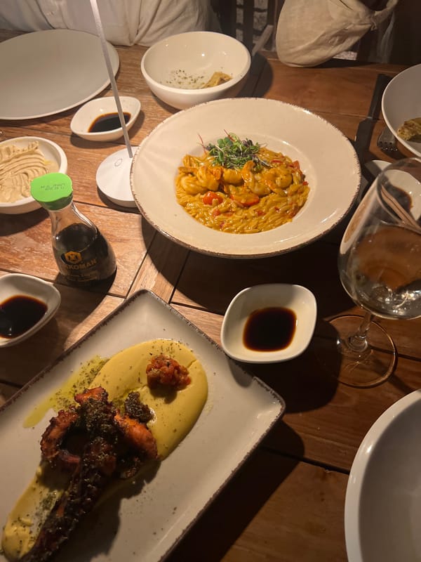 Table full of food and drinks at a Naousa restaurant