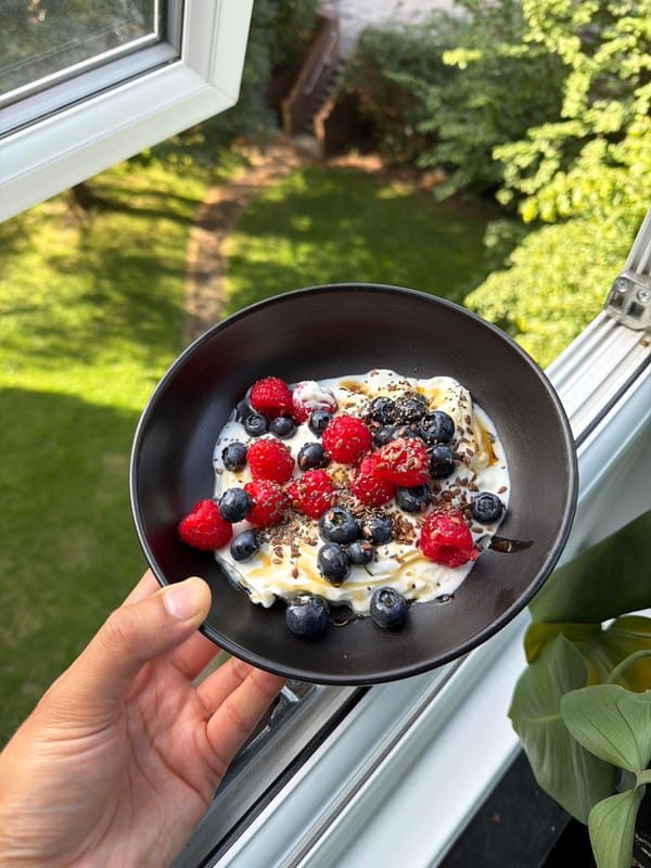 Berry and yogurt bowl on a sunlit London windowsill