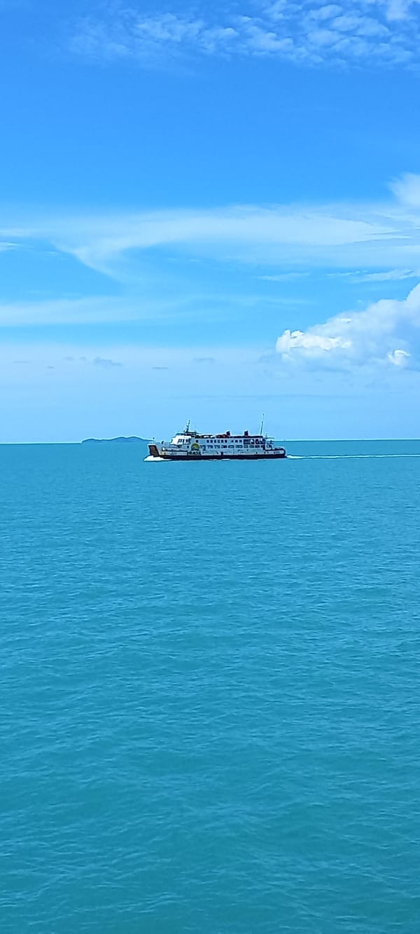Ferry crosses Thai waters under clear morning skies
