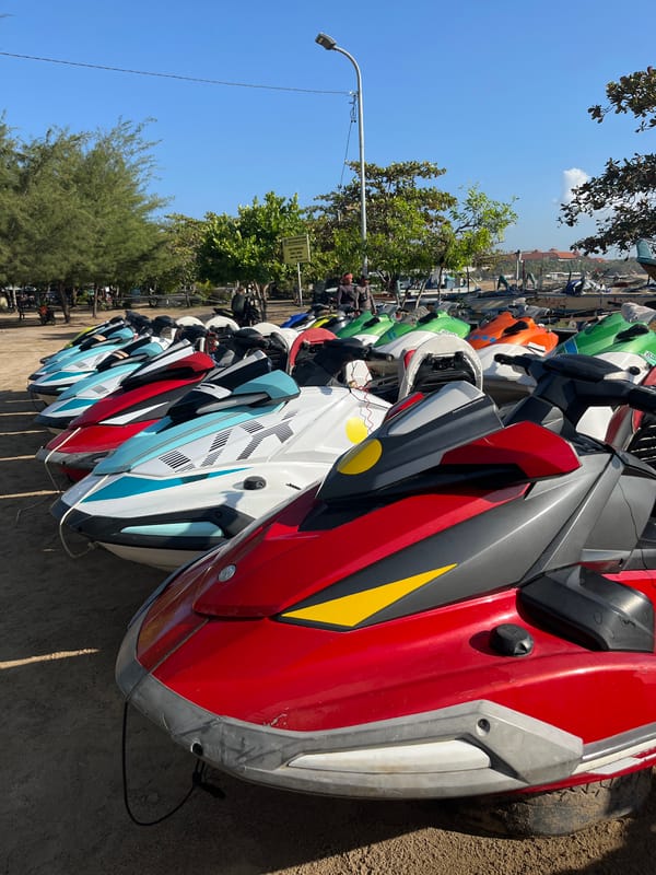 Jet ski fleet lines the shore in Kuta Selatan, Bali