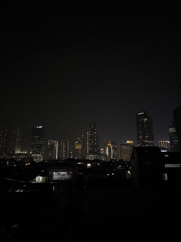 Nighttime South Jakarta skyline captured showing illuminated commercial towers