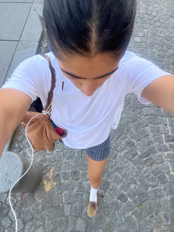 Woman takes selfies near Centre Pompidou in Paris