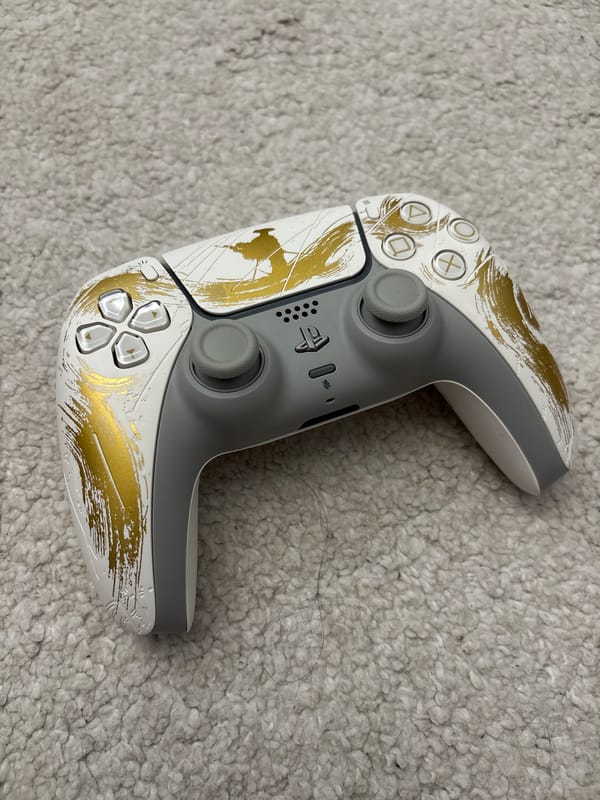 Decorated PlayStation 5 controller spotted on carpet