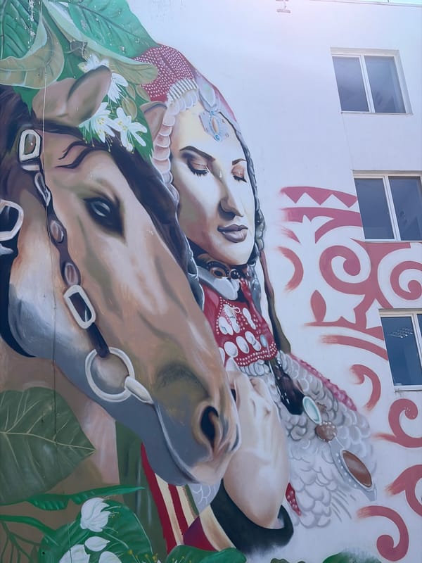 Traditional mural featuring woman and horse observed in Neftekamsk
