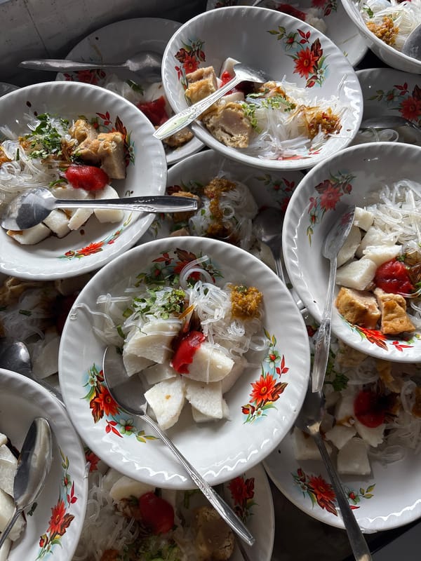 Traditional Indonesian meal served in decorative bowls in Kebonsari