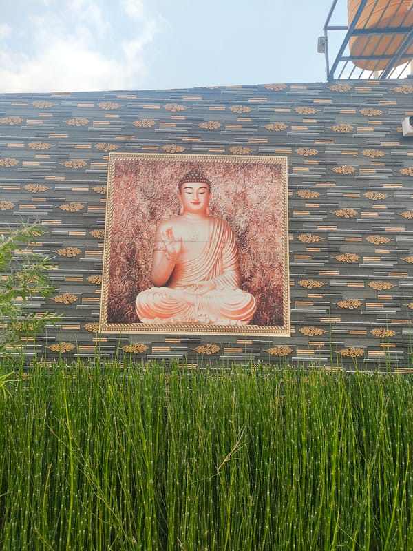 Buddha image displayed on decorative wall in Chandrappa Circle