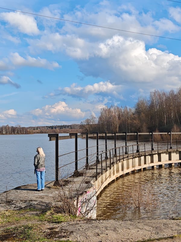 Woman photographed at water dam in Zhestylevo on sunny afternoon