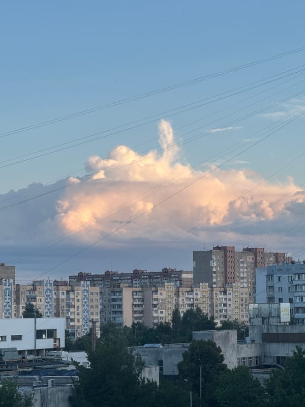 Kyiv residential skyline, mixed architecture under cloudy skies