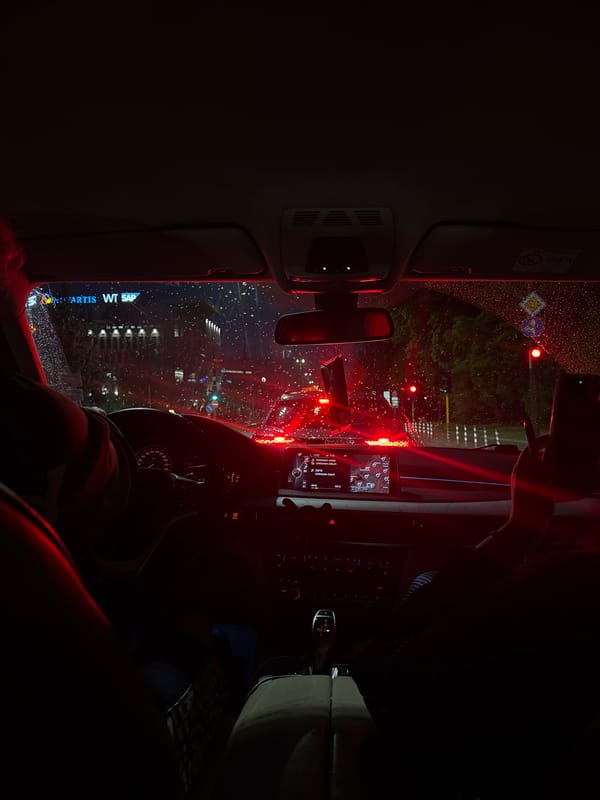 Rainy evening cityscape viewed from car interior in Sofia