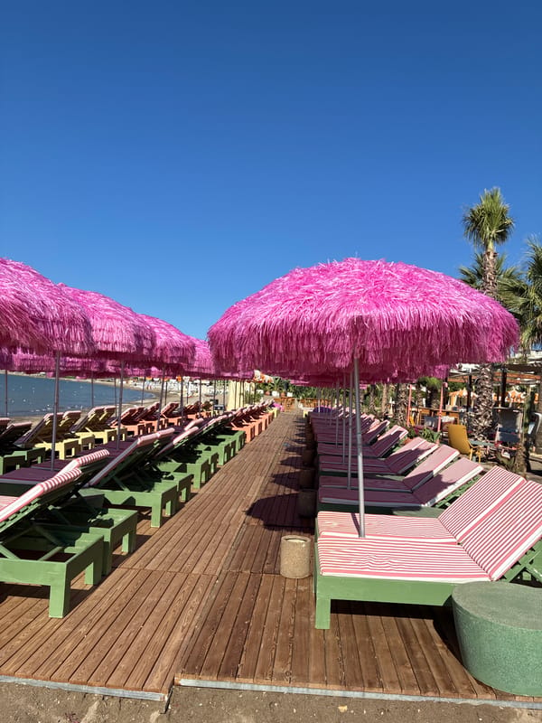 Alanya beach resort chairs and pink umbrellas, quiet morning