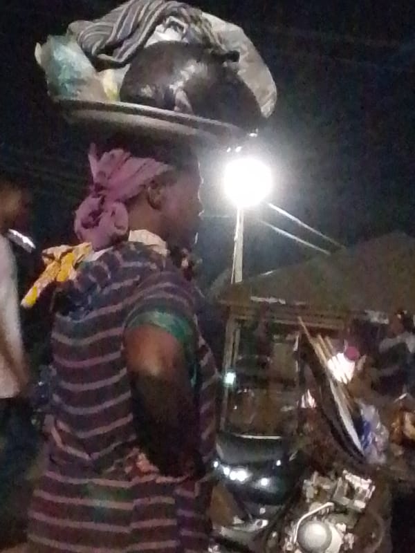Evening street vendors sell produce in Tamale Ghana