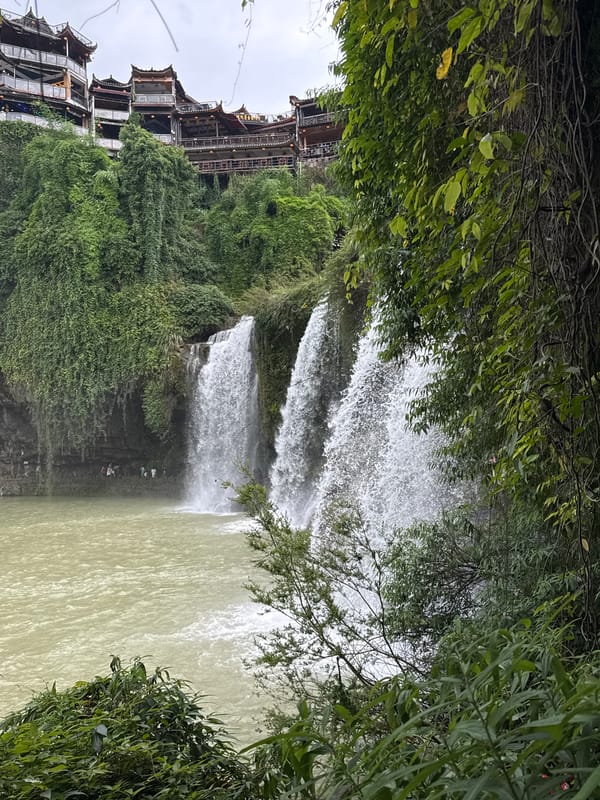 Morning tour captures Furong Waterfall and traditional Chinese architecture