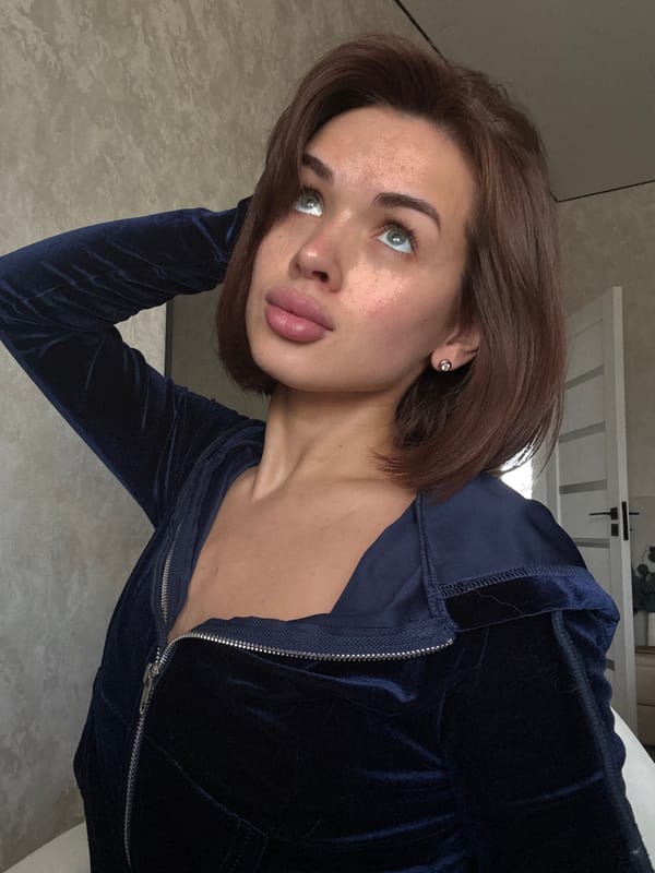 Woman poses for photos indoors in Russian village