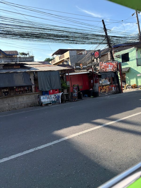 Davao City street scenes with overhead wires and mixed buildings