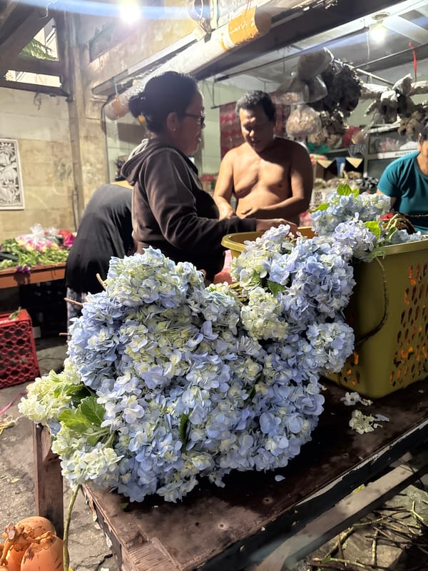 Evening flower market activity captured in Kuta, Indonesia