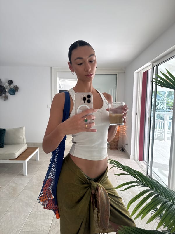 Young woman takes mirror selfies in Saint-Martin, France