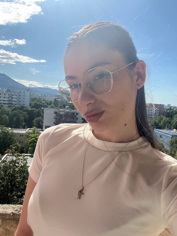 Balcony selfie session above a city skyline