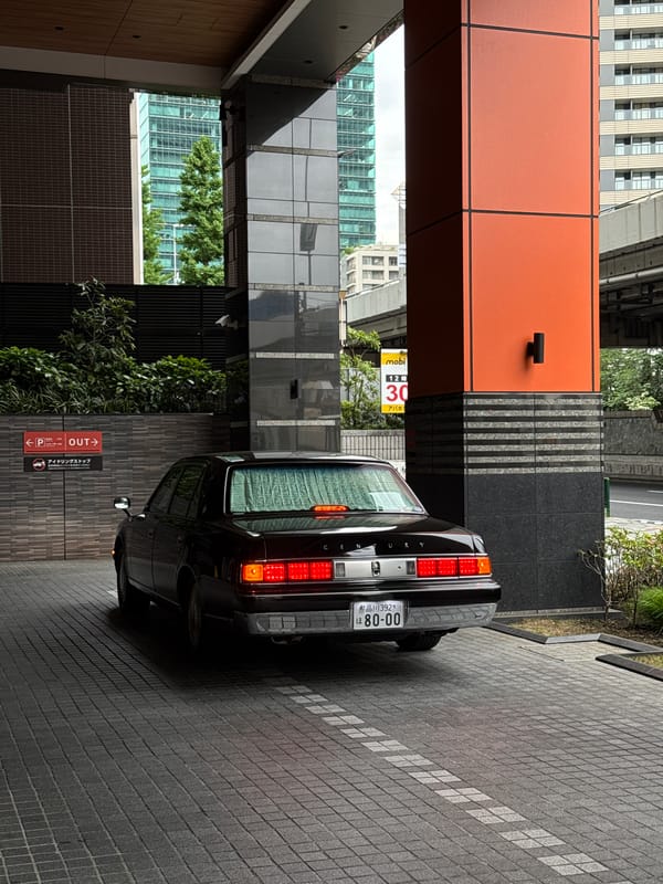 Black vehicles including luxury sedan observed on Minato streets