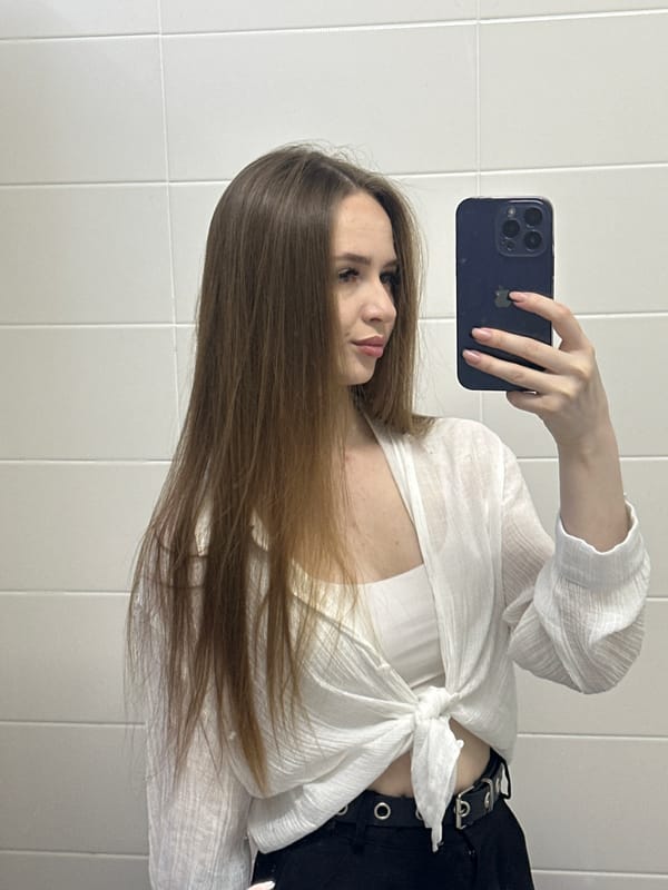 Woman takes multiple selfies in white outfits over 29 minutes