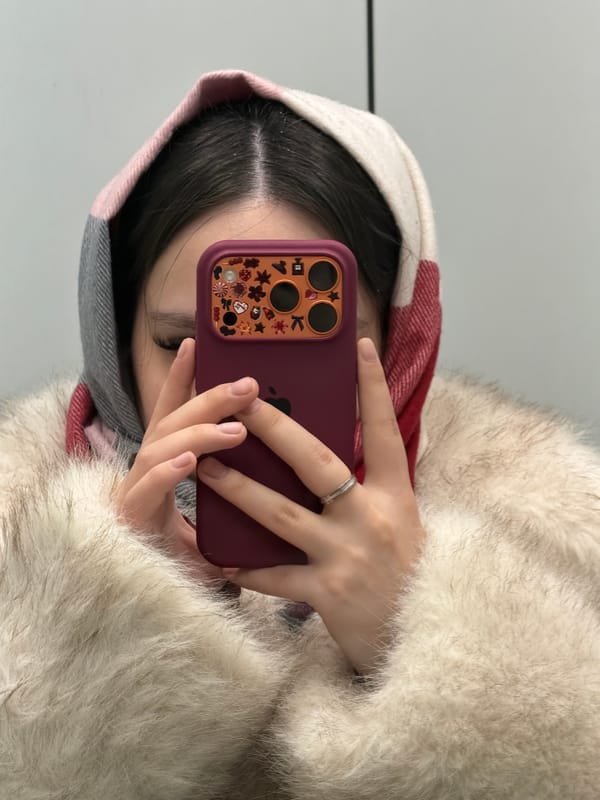 Person takes elevator selfies in winter coat, Perm Russia
