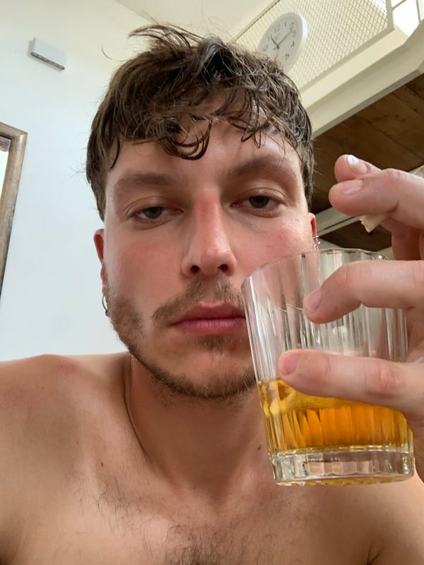Man observed drinking beverage indoors in Tel Aviv apartment