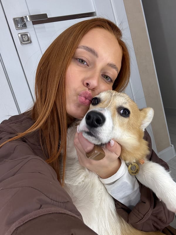 Woman takes selfie with small dog in Chaikovsky, Russia