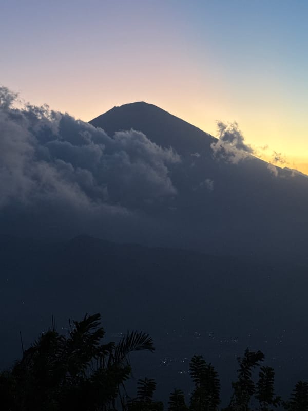 Mount Agung silhouetted at dusk in Abang, Indonesia