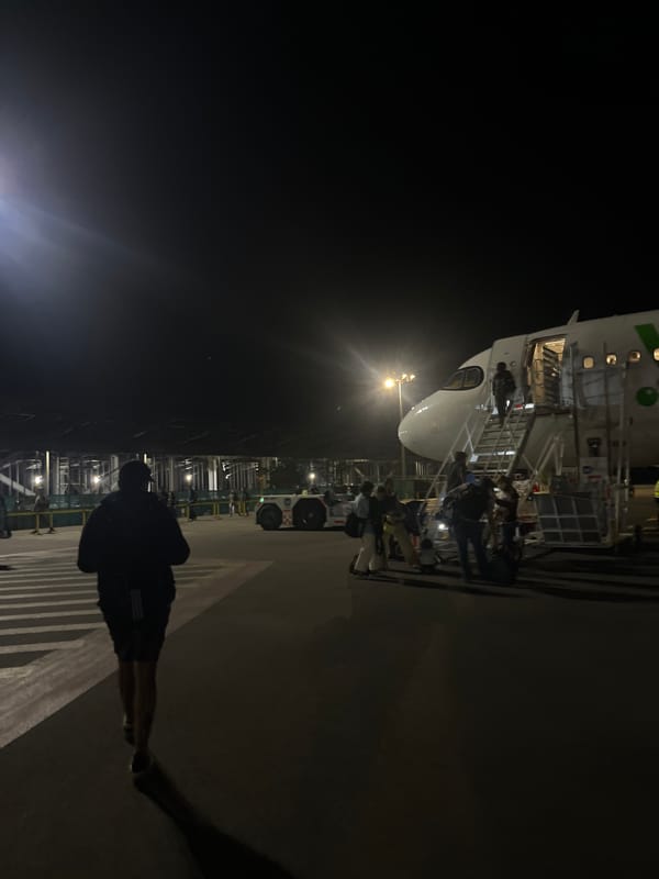 Night arrival at Puerto Escondido airport with passenger disembarkation
