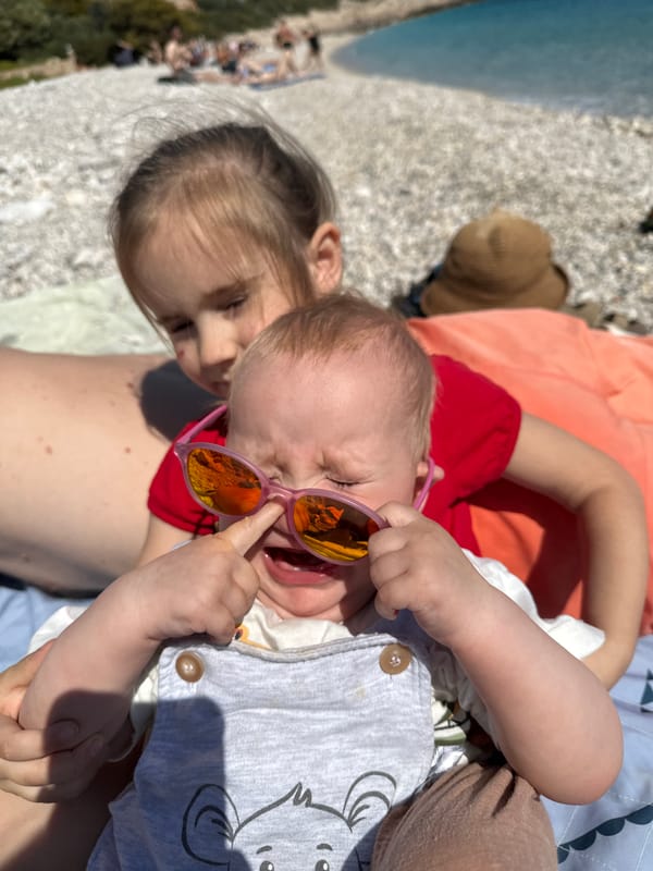 Woman walks to rocky beach in Kaş, Turkey