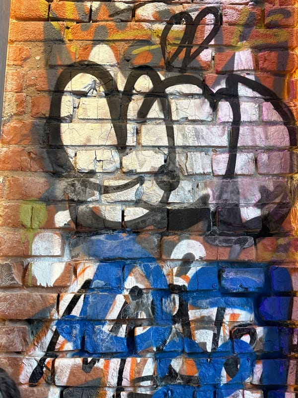 Graffiti spotted on textured brick wall in Kazan