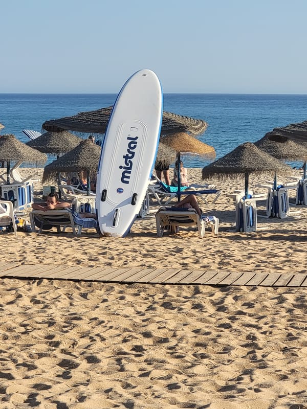 Quarteira beachfront promenade buzzing on a sunny summer afternoon