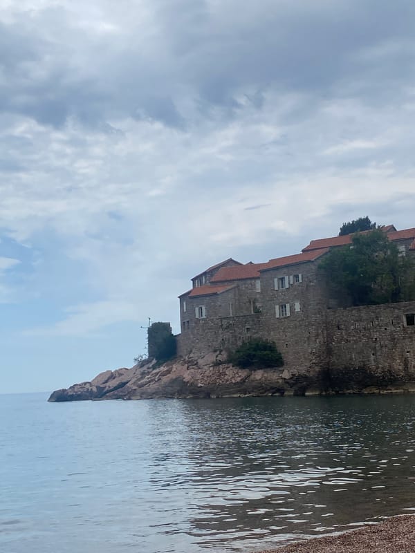 Tourist documents morning visit to Sveti Stefan, Montenegro resort