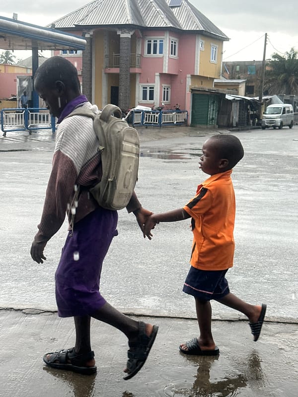 Rainy morning commute on foot and motorbike in Badagry