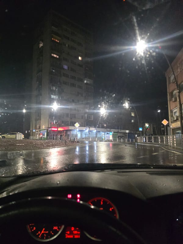 Rainy night drive captured through streets of Yambol, Bulgaria