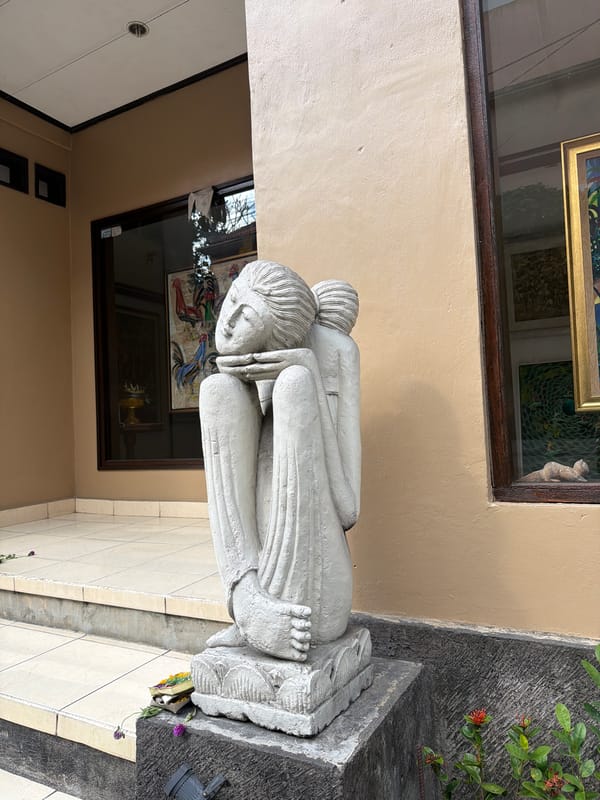 Street-level tour of Ubud's temples, statues, and daily life
