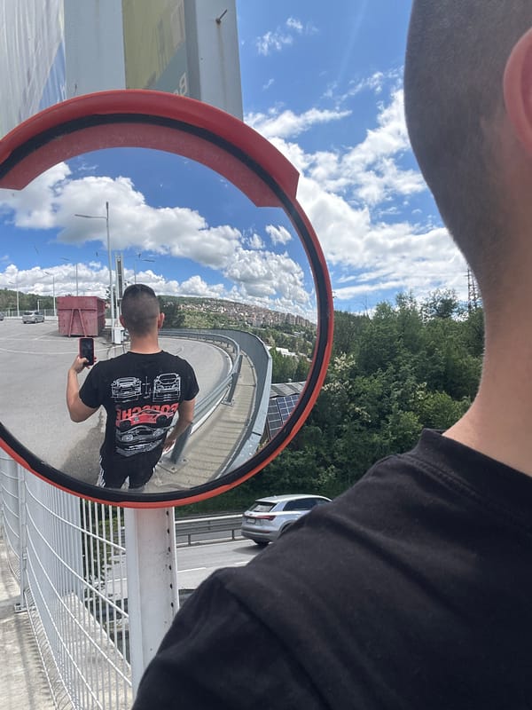 Tourist documents Veliko Tarnovo cityscape and mirror selfie