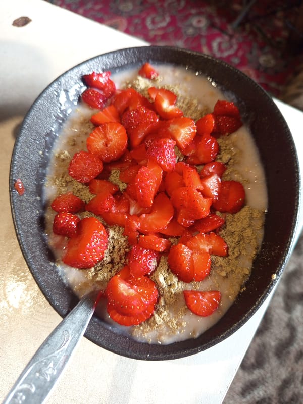 Oatmeal with strawberries, shot from above in Ostrovtsy