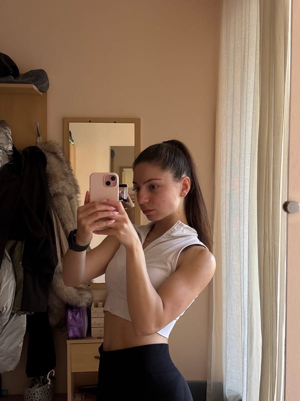 Young woman takes mirror selfies in Varna residential room