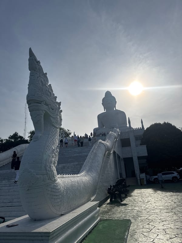 Tourists visit Great Buddha statue in Karon, Thailand