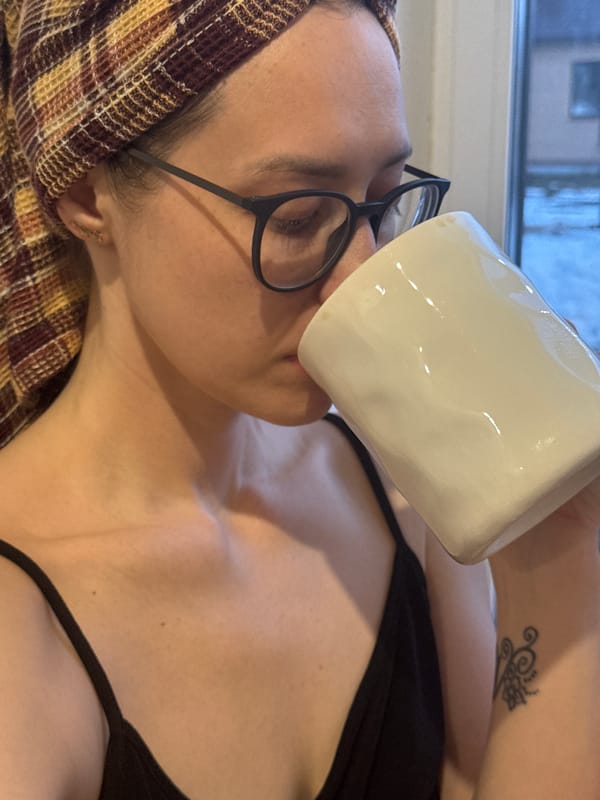 Woman enjoys morning coffee in Chaikovsky, Russia