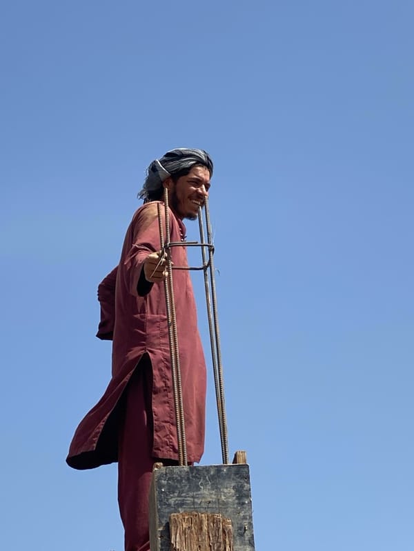 Construction worker builds concrete structure in Kandahar Afghanistan