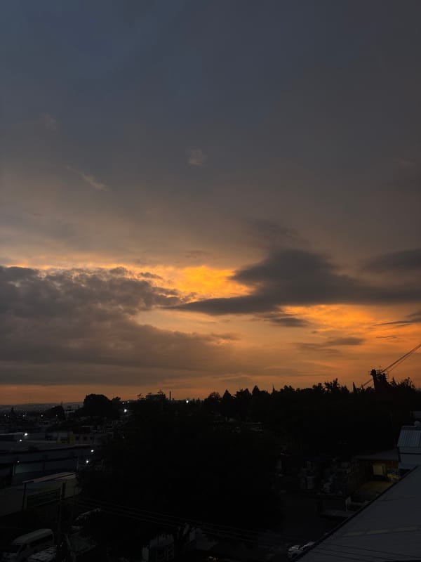 Evening clouds display golden glow over Puebla hotel district
