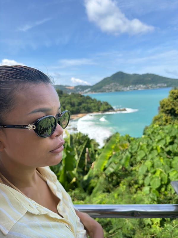 Woman photographed at Thai bay amid tropical landscape documentation