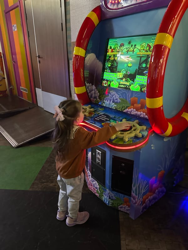 Family enjoys bowling and arcade games at Lyubertsy entertainment center