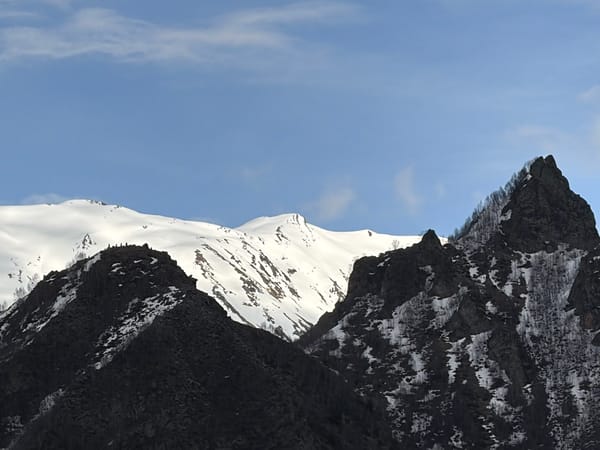 Mountain landscape with snow patches observed in Pkhelshe, Georgia