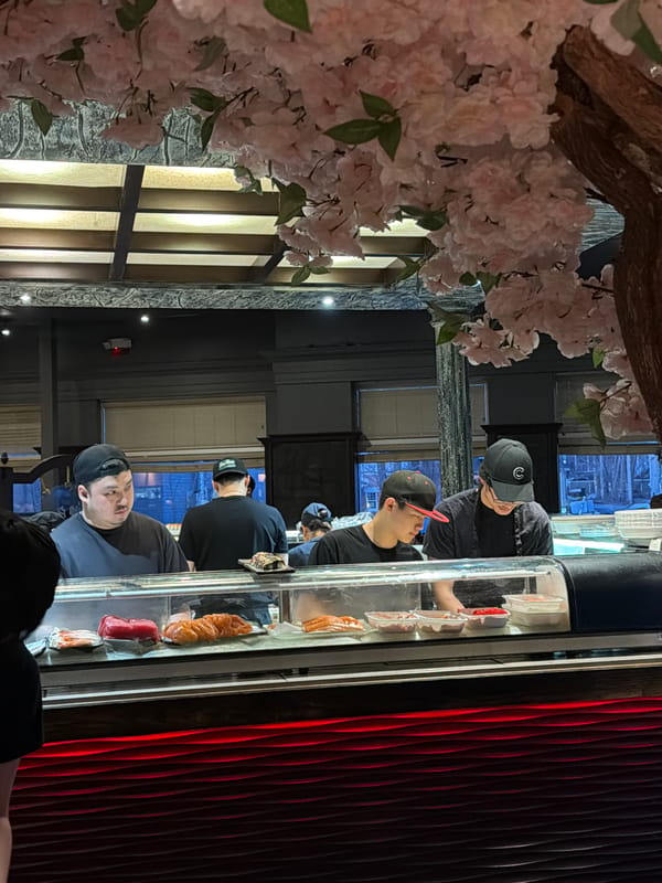 Sushi chefs prepare fresh rolls at Laval restaurant
