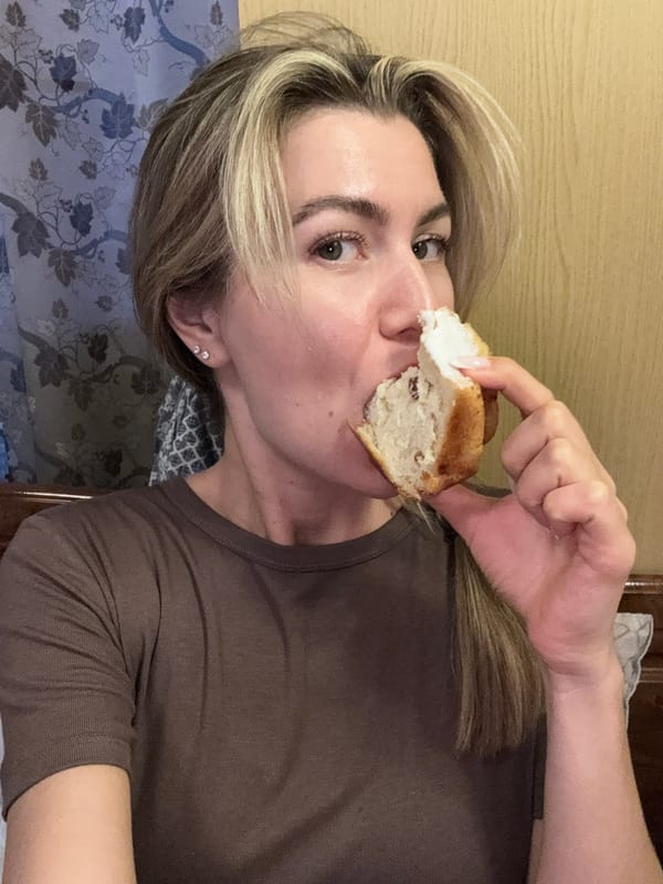 Woman makes coffee, takes mirror selfies with foamy beverage