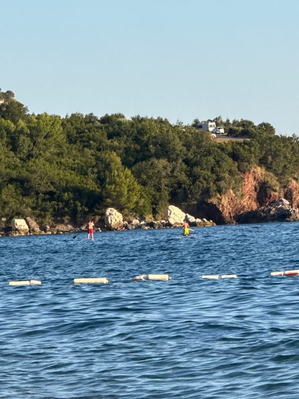 Calm waters and green hills along the Montenegrin coast